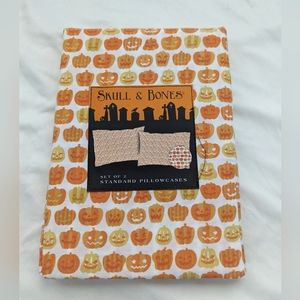 Pair of pumpkin Jack O Lantern pillowcases